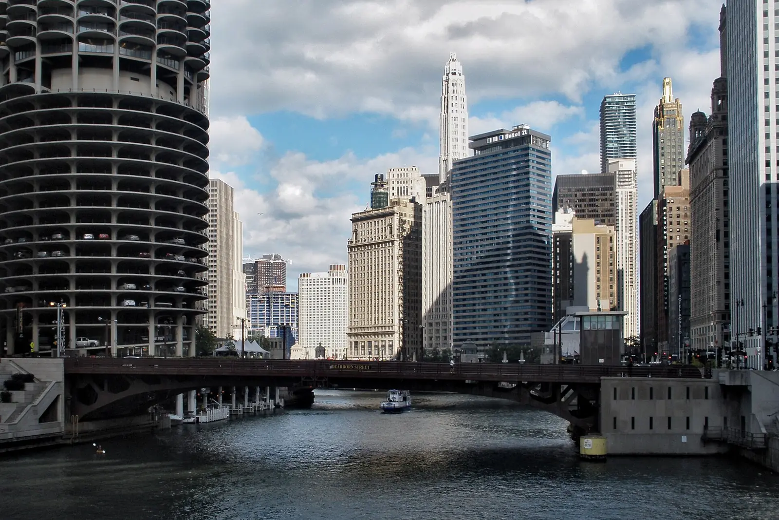 Chicago River lined with bridges and towers on a sunny morning