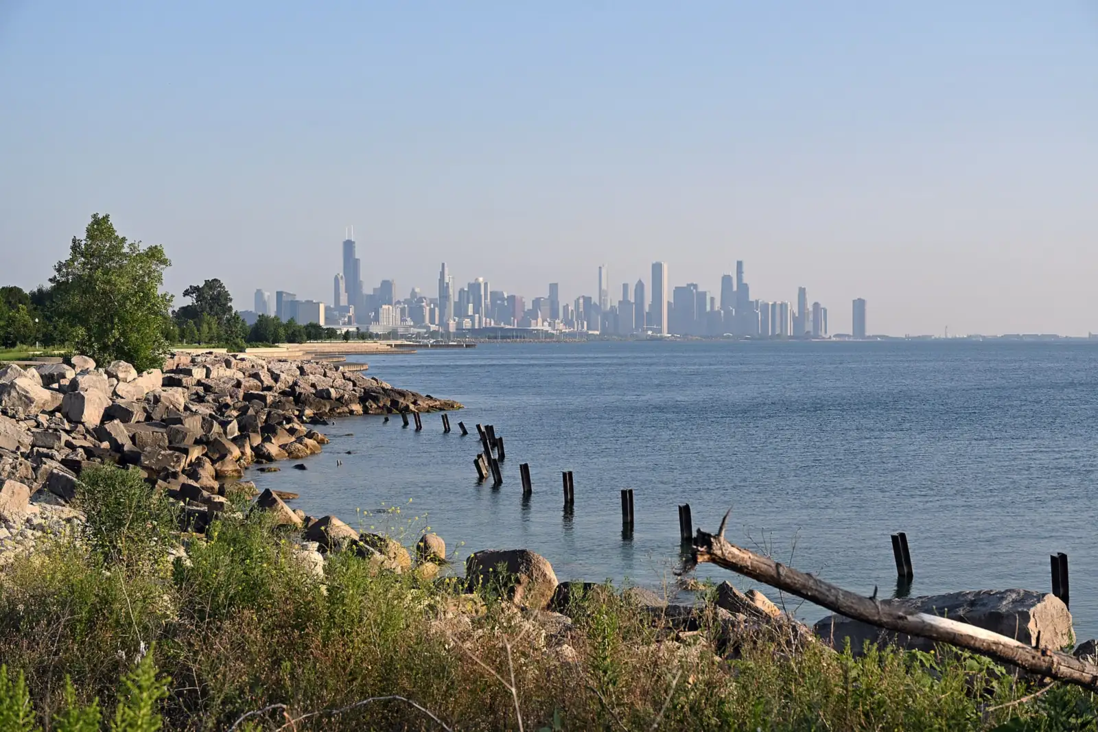 Chicago skyline across Lake Michigan from the Lakefront Trail near Morgan Point on a clear morning